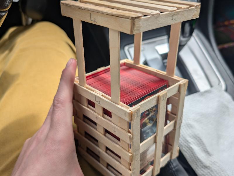 Popsicle stick cage finished with the top finished popping out of the body